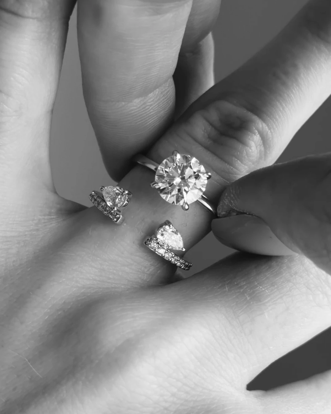Black-and-white close-up of diamond rings on a hand for The Black Friday Event